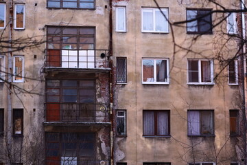 Poster - Tall building with multiple windows.