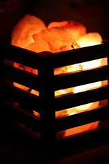Wall Mural - A warm and cozy scene of a burning fire with a grill in the background, perfect for outdoor or camping themed projects.