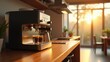 © Nima - Small kitchen appliances, A sleek espresso machine on a wooden countertop bathed in soft morning sunlight in a modern kitchen.