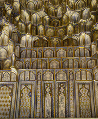 Intricate wall carvings showcasing traditional islamic art and architecture, creating a mesmerizing display of craftsmanship and cultural heritage