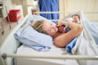 © peopleimages.com - Hospital, woman and skin with baby for bonding, maternal security and emotional wellbeing after birth. Healthcare, mother and newborn infant in maternity ward for sleep, labor and loving relationship