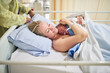 © peopleimages.com - Healthcare, woman and skin with baby for bonding, maternal security and hug for wellbeing after birth. Hospital, mother and newborn infant in maternity ward with doctor, labor and loving relationship