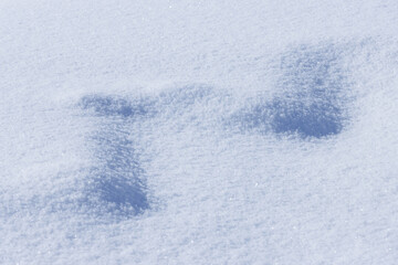 Wall Mural - zig-zag shape pattern on flat light blue snow surface