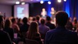 © TheWaterMeloonProjec - Presenter at a Business Conference with Attendees in the Audience.