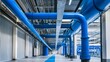 © jiraphat - A large industrial building with blue pipes running through it. The pipes are blue and are connected to the ceiling