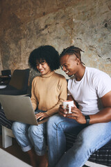 Poster - Happy, home and couple on laptop for online shopping, internet booking and digital reservation for vacation. Hotel, relax and African man and woman on computer for holiday, travel and accommodation