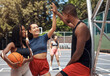 © peopleimages.com - Basketball, conversation and people on court, high five and break with wellness, winner and support. Friends, match and players with health, training and motivation with hand gesture and sports