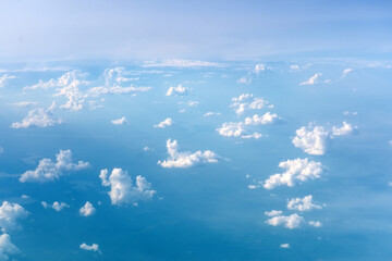Wall Mural - Aerial cloudscape view of the picturesque clouds and sky from a height in the evening at dawn over the horizon