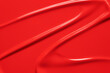 © Kat Ka - Red lipstick texture background. Creamy makeup product or paint swatch. Bright color liquid lipstick or lip gloss smeared