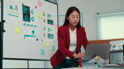 Aufkleber - Young manager explaining company strategy using charts and diagrams, analyzing financial statistics, working with laptop computer in startup office