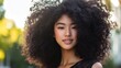 © Chotijah - Young Woman With Beautiful Curly Hair Outdoors