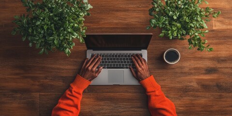 Leinwandbilder - Natural Wooden Workspace Top-Down View of Typing Hands on a Sleek Gray Laptop with Coffee - Digital Efficiency and Remote Work Content for Modern Business Audiences