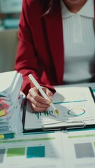 Aufkleber - professional businesswoman reviewing financial data, studying pie chart and bar graph on clipboard n