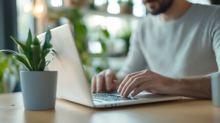 Poster - Professional Man Working on Laptop at Home with Indoor Plants Surrounding Him : Generative AI