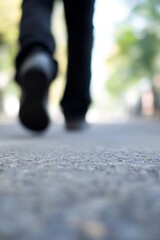 Poster - Blurred Perspective of Walking Feet on a City Pathway During a Bright Day : Generative AI