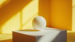 © Juan - Minimalist composition of a white sphere on a golden pedestal