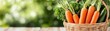 © nattapon98 - A basket of fresh carrots, vibrant and healthy, placed on a wooden surface with a soft, blurred green background.