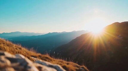 Aufkleber - Stunning sunrise over panoramic mountain landscape creating a warm glow of sunlight : Generative AI