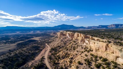 Canvas Print - Breathtaking panoramic view of a rugged landscape featuring cliffs and mountains : Generative AI