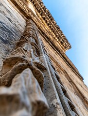 Aufkleber - Intricate Stone Carving Detail Under Bright Blue Sky : Generative AI