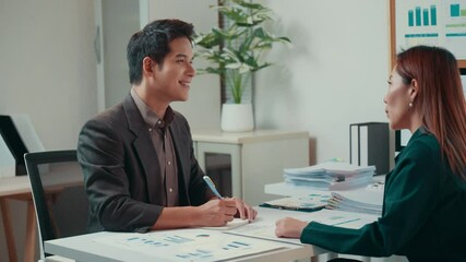 Poster - Professional businesspeople reviewing financial reports, collaborating closely while working together in modern, minimalist office environment