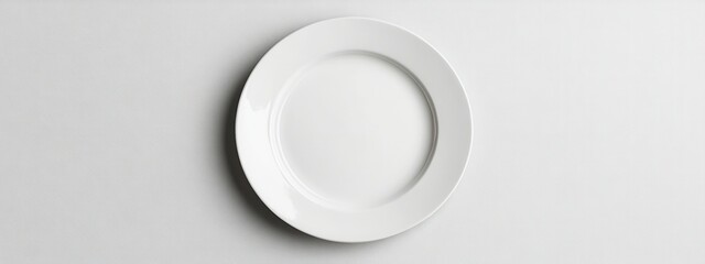 Poster - Minimalist White Plate on Plain Background for Elegant Dining Presentation