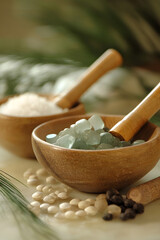 Poster - Natural Spa Set with Wooden Bowls Filled with Salt and Polished Stones on a Relaxing Background : Generative AI