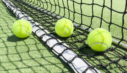 Wall Mural - close up of a padel and tennis court with artificial grass and balls