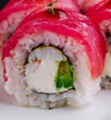 © AntAlexStudio - Fresh tuna sushi roll close-up