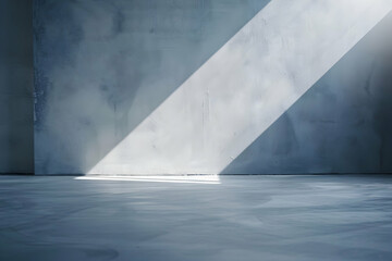 Poster - A serene interior space with a beam of sunlight illuminating a smooth concrete floor
