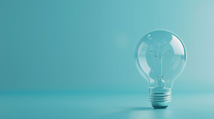 Poster - Clear light bulb on a soft blue background, symbolizing innovation and creativity