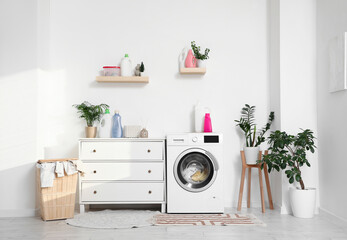 Wall Mural - Interior of laundry room with washing machine, shelves and basket