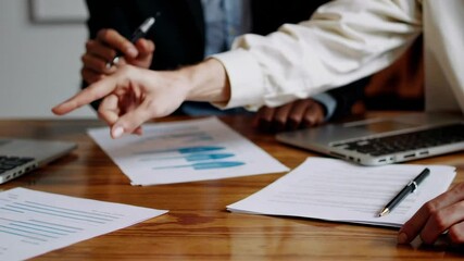 Poster - Professional business team analyzing financial data, carefully reviewing charts and graphs while collaborating on strategic insights during corporate meeting