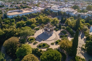 Poster - Aerial view of a park with a clock tower, suitable for use in architecture or urban planning contexts
