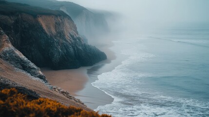 Wall Mural - a scenic view of the ocean from the edge of a cliff, with waves crashing against the rocks below