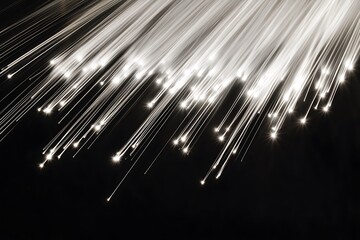 Poster - Glowing fiber optic strands on black background.