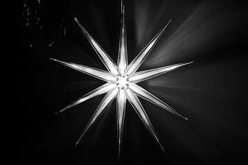 Aufkleber - Glowing starburst, monochrome, dark background.