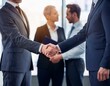 © Rahmat  - People shake hands, international company concept