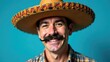 © Helga P-A. - A man with a large mustache and sombrero smiles broadly against a turquoise background.Concept of Mexican character. Cinco de Mayo concept