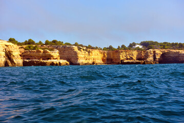 Wall Mural - The Algarve Rocks Formation is a unique and stunning natural wonder located in the coastal town of Porches Portugal