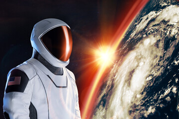 Wall Mural - spaceman in outer space on earth planet background. exploration theme.