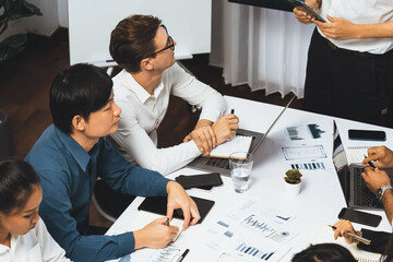 Leinwandbilder - Analyst team utilizing BI Fintech to analyze financial data at table in meeting room. Businesspeople analyzing BI dashboard power on paper for business insight and strategic marketing planning.Prudent
