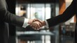 © azi - A Strong Partnership: Two Businesspeople Shake Hands, Sealing a Deal