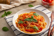 © Kritchai - Spaghetti with fresh tomatoes sauce in white plate.topped with parmesan cheese and basil.