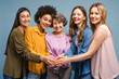 © Maria Vitkovska - Five smiling women of different ages and ethnicities joining hands together