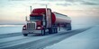 © Diffin - A powerful truck navigates a snowy road while towing a tanker, showcasing resilience and adaptability in challenging winter conditions.