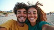 © Z A C - Couple taking selfie at beach