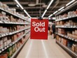 © Kos - A bold red Sold Out sign hangs prominently in a supermarket aisle, surrounded by shelves filled with various products, indicating a popular item is no longer available.