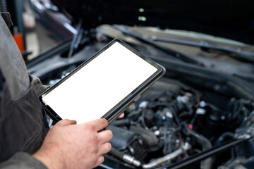 Poster - Serviceman with tablet checks car software in car service