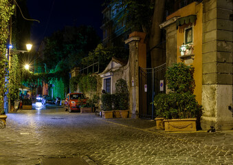 Wall Mural - night view of old narrow street in rome, italy. architecture and landmark of rome. cozy cityscape of
